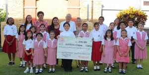 Class representatives pose with Deacon Frank and Mrs. Maria Tenorio after the check presentation to the Archdiocese of Agana in support of Kamalen Karidat and the Gentle Refuge Crisis Pregnancy Center.