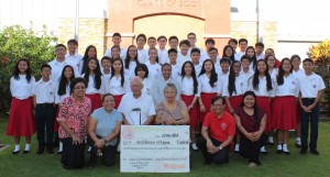 Eighth graders pose for a formal photo with Deacon Frank and Mrs. Maria Tenorio after the presentation of their donation. Joining them are: (L-R) SBCS Vice-Principal, Sister Maria Rosario Gaite; SBCS Director of Faith Formation, Ms. Bernadette Alcantara; 8th Grade Advisers, Mr. Joel Suplido and Ms. Margarita Pangelinan.