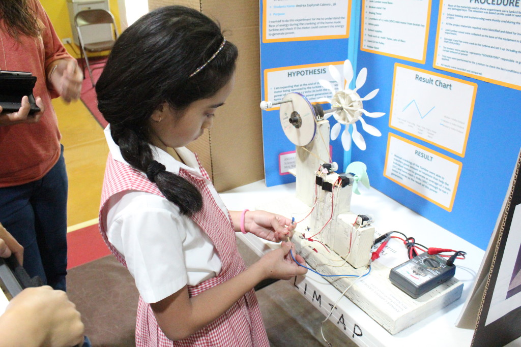 Can a Homemade Turbine Operated Manually Generate Power *Picture taken during the school wide science Fair